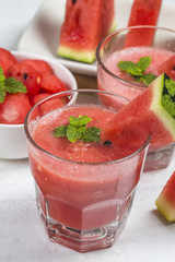 Watermelon drink in glasses with slices of watermelon