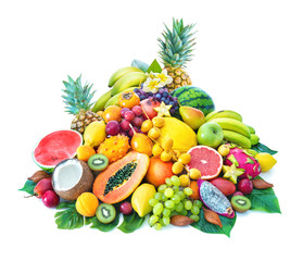 Assortment of tropical fruits with palm leaves and exotic flowers