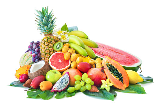Fototapeta Assortment of tropical fruits with palm leaves and exotic flowers