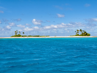 reef ring, lagoon and motu with palm trees on Makemo Atoll, Tuamotus archipelago, French Polynesia, France,