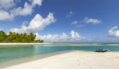 reef ring, lagoon and motu with palm trees on Makemo Atoll, Tuamotus archipelago, French Polynesia, France,