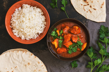 Chicken tikka masala with rice. Asian-Indian dish. Top view, flat lay