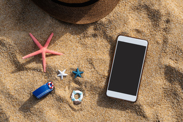 Starfish on tropical beach with smart phone, Summer vacation concept