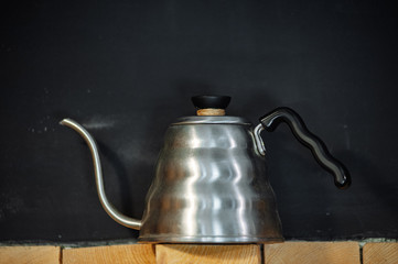 the kettle for coffee and tea. Kitchen for cook. Black background