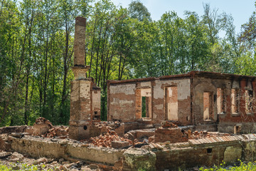 Fototapeta premium Brick building after the fire. Remains of the chimney