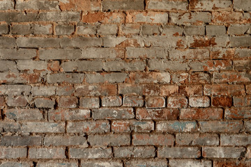 Weathered texture of stained old dark brown and red brick wall background