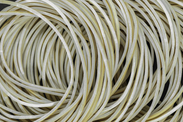 Many brown rubber rings placed one on each other background surface