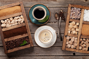Coffee cup, roasted beans and brown sugar