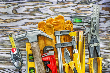 Set of construction tools on wooden board