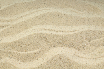 Fototapeta na wymiar Sand on the beach as background. Concept of rest. Top view.