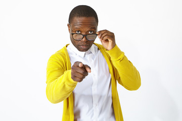 Portrait of fashionable young African man employee or student wearing white shirt and yellow...