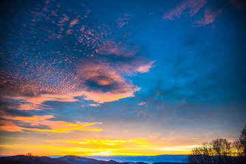 Fototapeta na wymiar Fantastic colors of clouds at winter sunrise