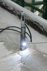 welds of a railing during the renovation of a roof in the evening in Italy