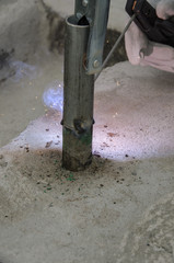 welds of a railing during the renovation of a roof in the evening in Italy