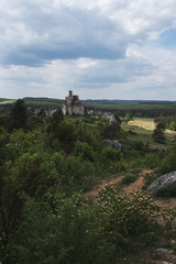 Fototapeta na wymiar Old ruined castle on beautiful landscape