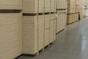 Warehouse of fiberboard and chipboard. Construction Materials. Wooden warehouse