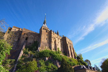 Wonderful wide angle view of ancient Mont Saint-Michel. View from a small park under the abbey. Normandy, France, Europe