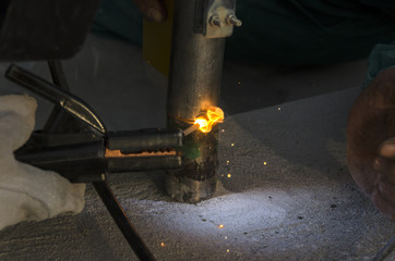 welds of a railing during the renovation of a roof in the evening in Italy