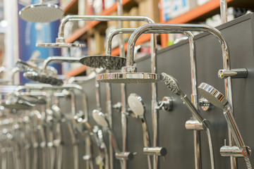 Shower head on the stand in a hardware store. selected focus. set of shower heads.
