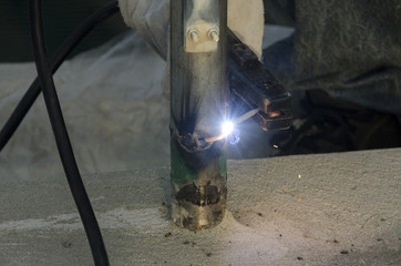 welds of a railing during the renovation of a roof in the evening in Italy