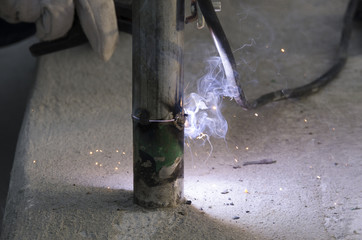 welds of a railing during the renovation of a roof in the evening in Italy
