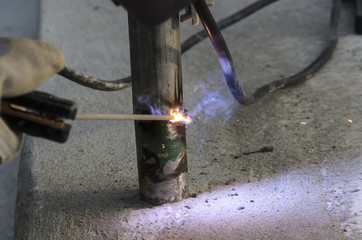 welds of a railing during the renovation of a roof in the evening in Italy