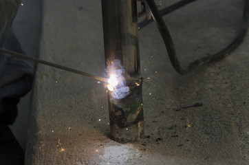 welds of a railing during the renovation of a roof in the evening in Italy