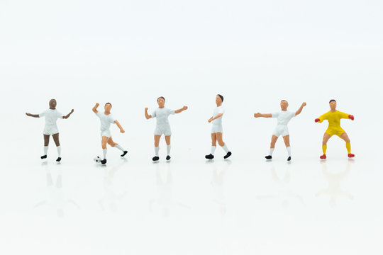 Miniature people : Football team image use for football of the year, world cup , sport concept.