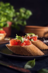 Italian bruschetta on dark background