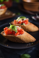 Italian bruschetta on dark background