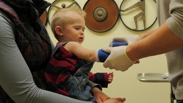 Baby boy gets a cast at clinic