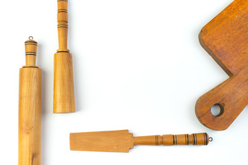 Set of the wooden kitchen utensils on White Background. Top view. Copy space for text.