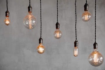 Edison retro lamp Incandescent bulbs on gray plaster wall background