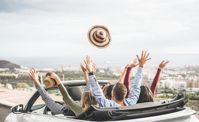 Happy people having fun in convertible car in summer vacation - obrazy, fototapety, plakaty