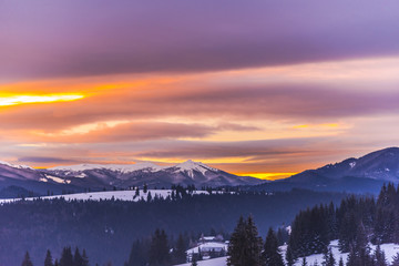 Fantastic colors of clouds at the sunset in Carpathians Mountains