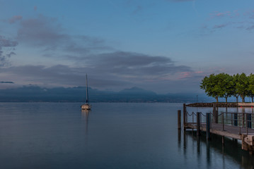 Colorful sunrise on the marina of Lausanne on the Lake Leman in summer with the view of the Swiss Alps in background - 14