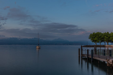 Colorful sunrise on the marina of Lausanne on the Lake Leman in summer with the view of the Swiss Alps in background - 15