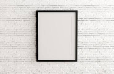 Blank black picture frame template for place image or text inside on white brick wall.
