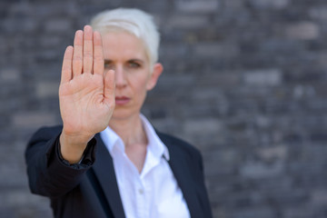 Woman making a halt or stop gesture