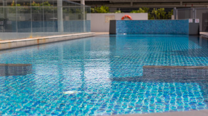 Obraz na płótnie Canvas Beautiful luxury swimming pool with Pool stair on sunny day
