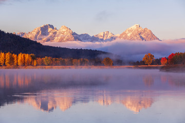 Scenic Sunrise Reflection of the Tetons in Autumn