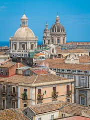 Rooftop view in Catania, with the domes of the Church of the Badia di Sant'Agata and the Sant'Agata Cathedral. Sicily.