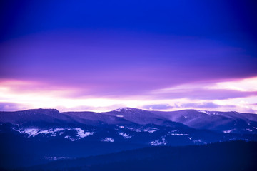 Obraz na płótnie Canvas Winter clouds at the sunset