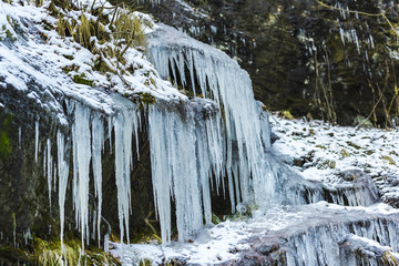 Icicles on the stones ion cold winter
