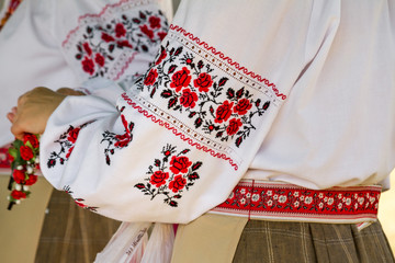 Beautiful Ukrainian embroidery on authentic women folk clothes, close-up