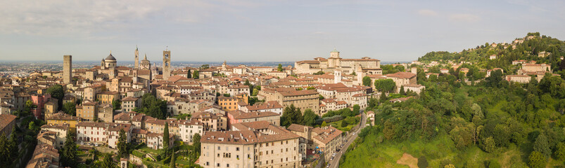 Fototapeta na wymiar Drone aerial view of Bergamo - Old city. One of the beautiful town in Italy. Landscape to the city center and its historical buildings