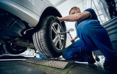 Automotive suspension test and brake test rolls in a auto repair service.