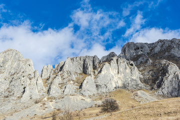 Fototapeta premium Mountains stone and white clouds