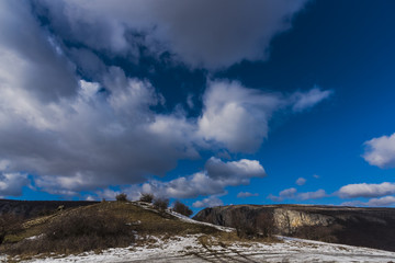 Mountains stone and white clouds