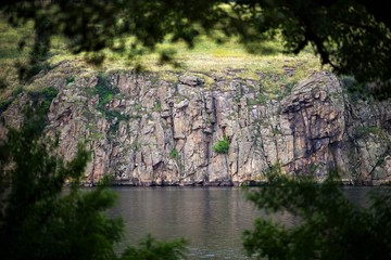 rocky hill on the other side of the river
